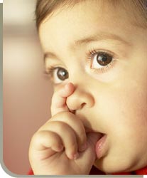 stock photo of baby sucking thumb